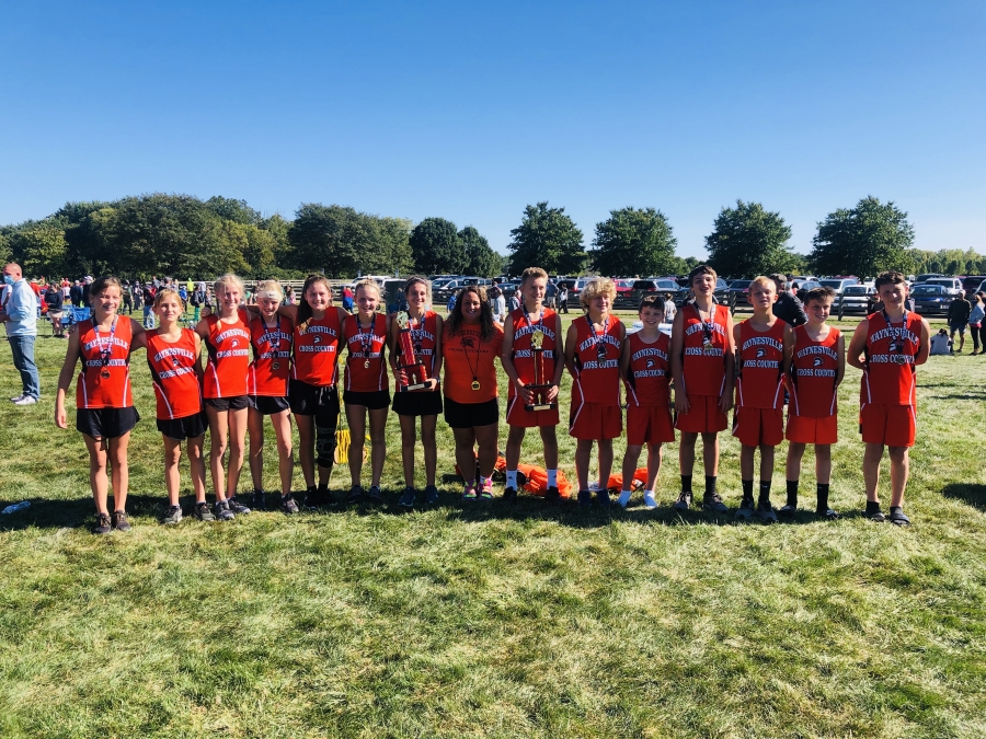 picture of a bunch of kids wearing matching orange shirts